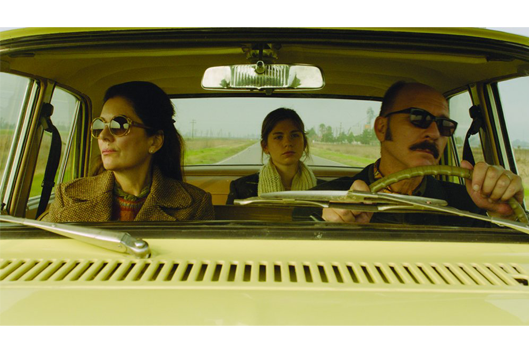 still from film, 3 people in a car
